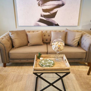 Tip: When staging your home for sale, be sure to remove any excess furniture pieces & declutter. Gives the illusion of more space in the room. photo