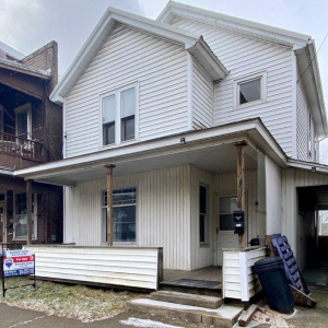 PRICE REDUCED TO $42,000 IN REYNOLDSVILLE! Perfect for an investment or starter home! 3 Bedroom, 1.5 Bath, 2 story House conveniently located close to shopping & ball park. Home features large rooms, 2 car detached garage, & off street parking. It also photo