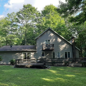 FOR SALE IN TREASURE LAKE FOR $165,000! 4 bedroom, 2.5 bath home features a formal dining room, lots of windows to bring the outdoors in, a fireplace and a pellet stove. Ideally located at the end of a cul-de sac, back a private driveway, with a seclu photo